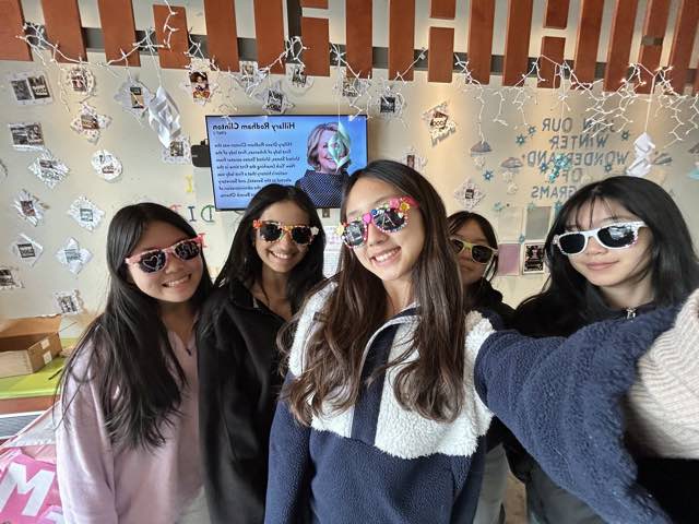 Members wearing the sunglasses they decorated at our library booth